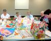 Members of the Friends of the Liberty Lake Municipal Library get decorations ready for the Annual Garden Tea Party to be held April 27 at the Meadowwood Technology Campus.
